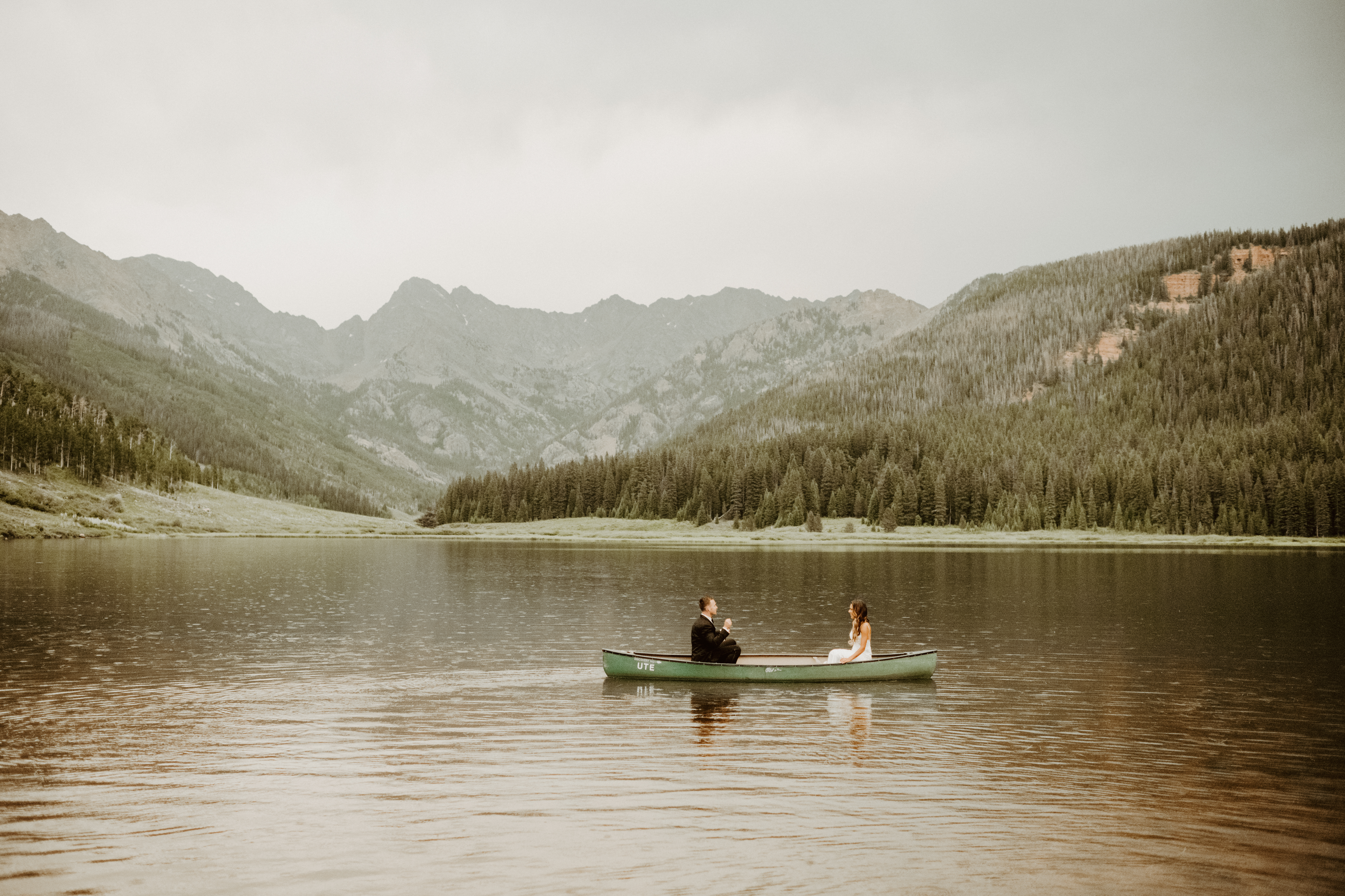 Couple rowing boat wedding at Piney River Ranch